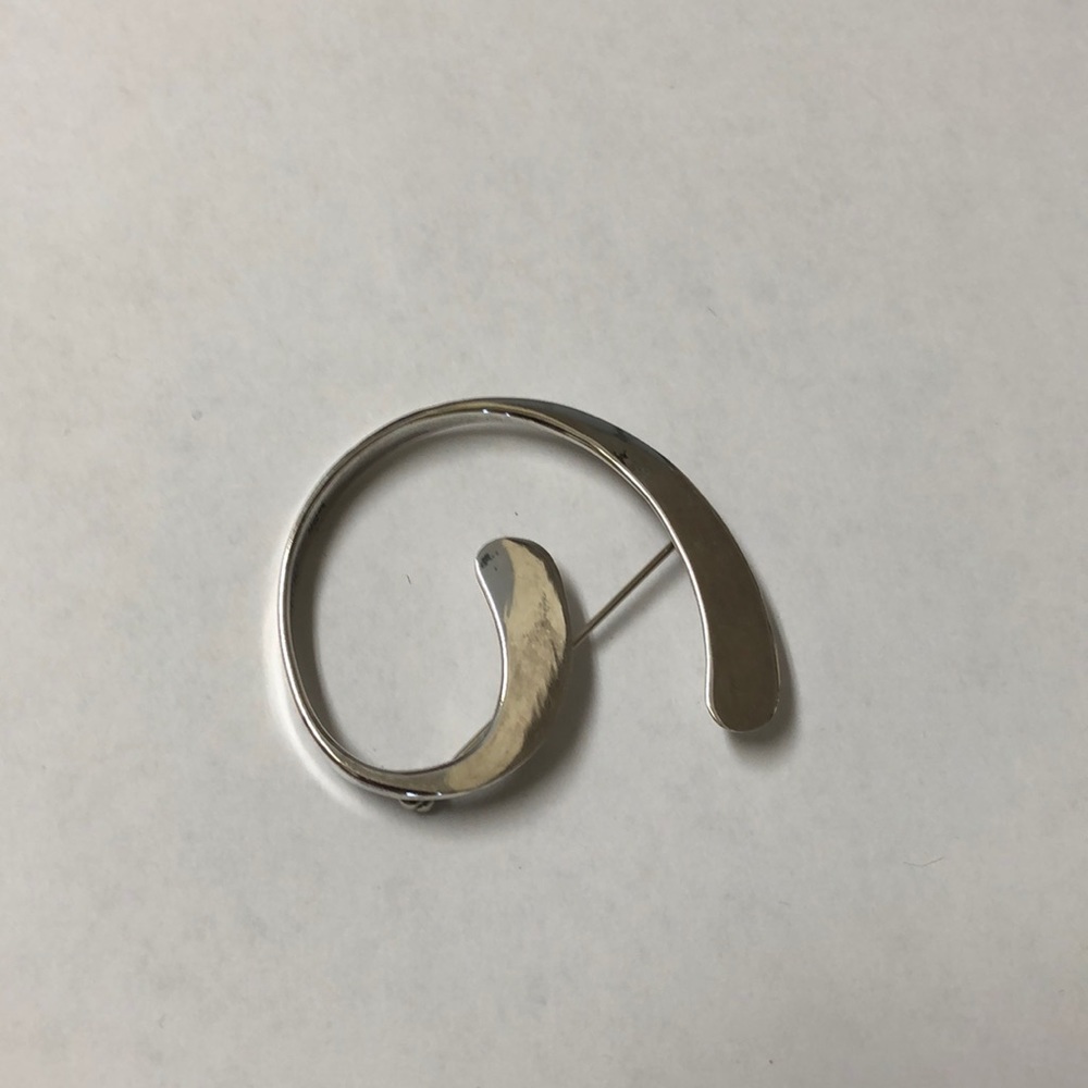 Sterling silver pin.